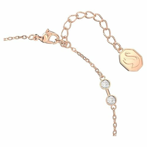 Bracelet en or avec chaîne et deux diamants.