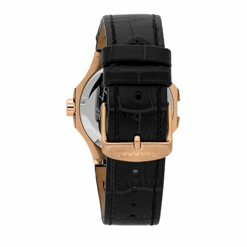 Montre de luxe avec bracelet en cuir noir et boucle dorée.